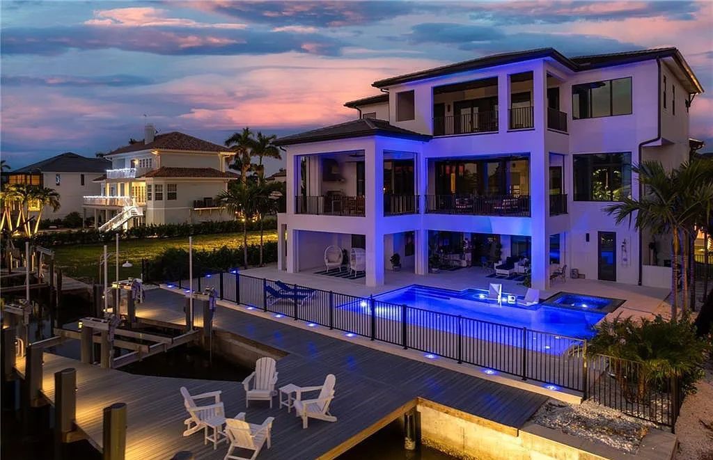 Experience the epitome of luxury living at 241 Egret Avenue, an impressive waterfront gulf access home in Naples, Florida. This newly built three-story residence boasts 5 bedrooms, 7 baths, and a wealth of upscale features.