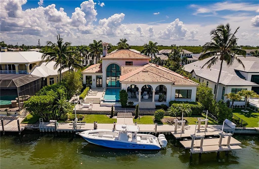 Discover the ultimate Naples, Florida retreat at 2450 Tarpon Road, "The Gateway to Naples Bay." This exceptional property offers a luxurious 4+den/4.5 bath home with 4,450 square feet of living space, recently re-decorated and furnished by Clive Daniel