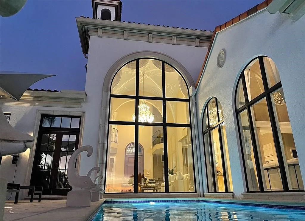 Discover the ultimate Naples, Florida retreat at 2450 Tarpon Road, "The Gateway to Naples Bay." This exceptional property offers a luxurious 4+den/4.5 bath home with 4,450 square feet of living space, recently re-decorated and furnished by Clive Daniel