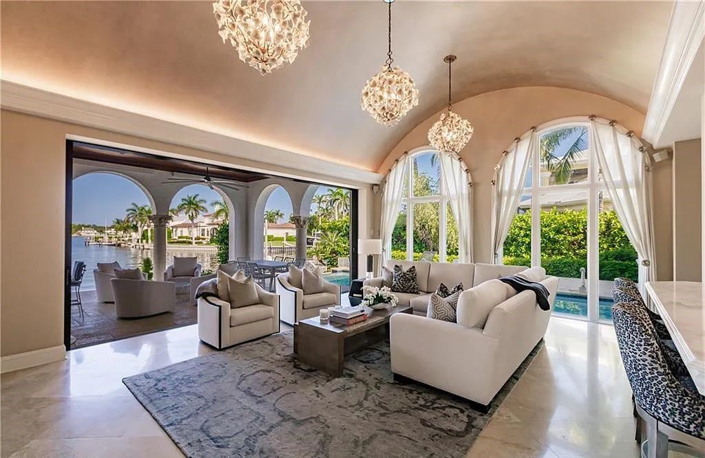 Discover the ultimate Naples, Florida retreat at 2450 Tarpon Road, "The Gateway to Naples Bay." This exceptional property offers a luxurious 4+den/4.5 bath home with 4,450 square feet of living space, recently re-decorated and furnished by Clive Daniel