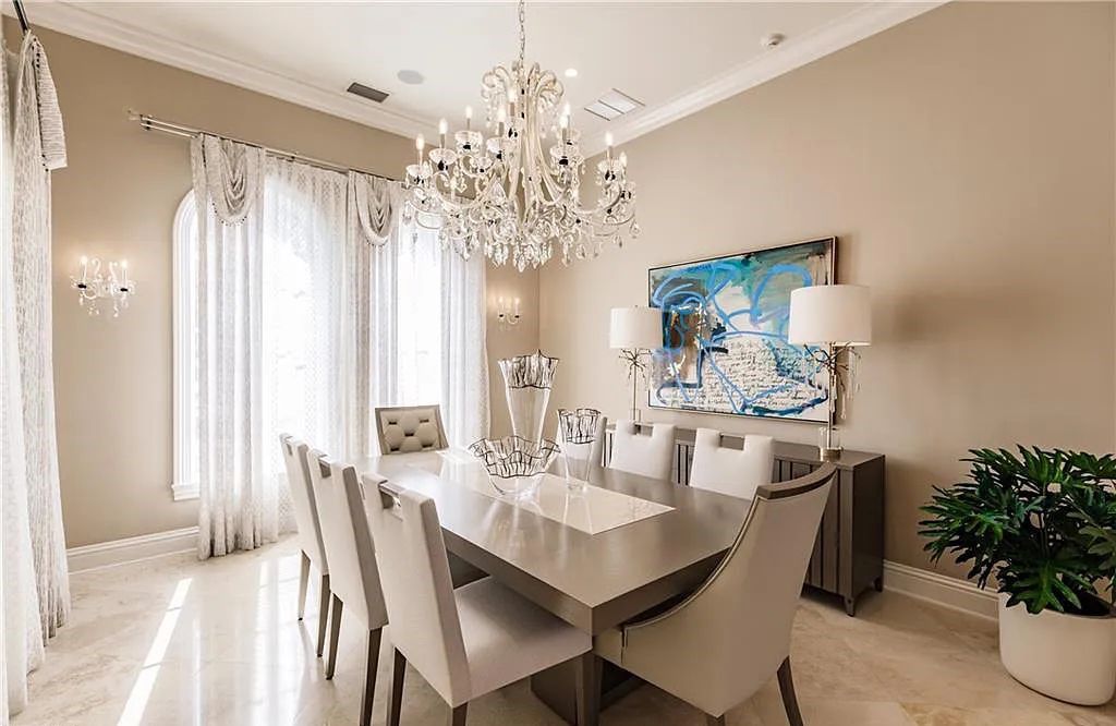 Discover the ultimate Naples, Florida retreat at 2450 Tarpon Road, "The Gateway to Naples Bay." This exceptional property offers a luxurious 4+den/4.5 bath home with 4,450 square feet of living space, recently re-decorated and furnished by Clive Daniel