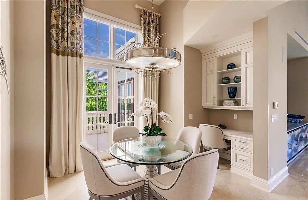 Discover the ultimate Naples, Florida retreat at 2450 Tarpon Road, "The Gateway to Naples Bay." This exceptional property offers a luxurious 4+den/4.5 bath home with 4,450 square feet of living space, recently re-decorated and furnished by Clive Daniel