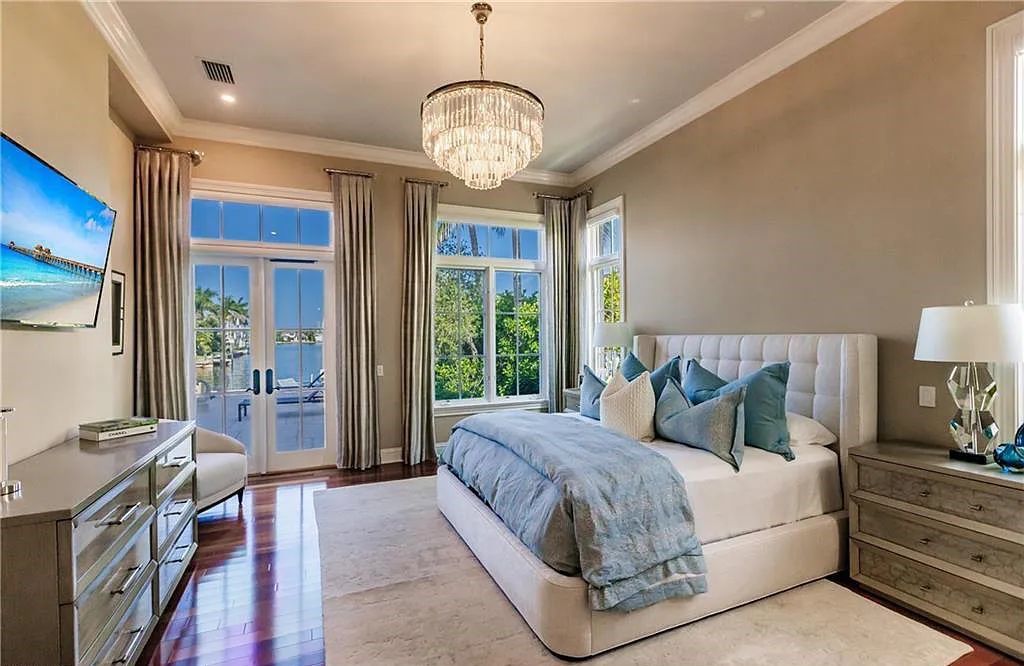 Discover the ultimate Naples, Florida retreat at 2450 Tarpon Road, "The Gateway to Naples Bay." This exceptional property offers a luxurious 4+den/4.5 bath home with 4,450 square feet of living space, recently re-decorated and furnished by Clive Daniel