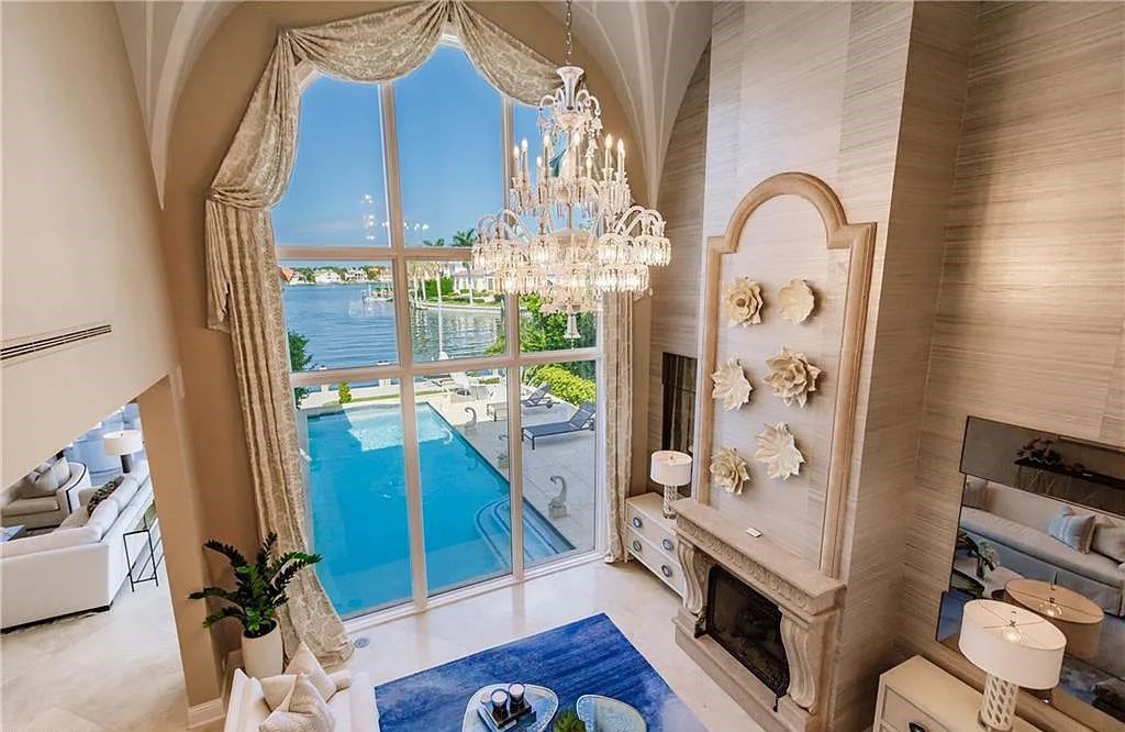 Discover the ultimate Naples, Florida retreat at 2450 Tarpon Road, "The Gateway to Naples Bay." This exceptional property offers a luxurious 4+den/4.5 bath home with 4,450 square feet of living space, recently re-decorated and furnished by Clive Daniel