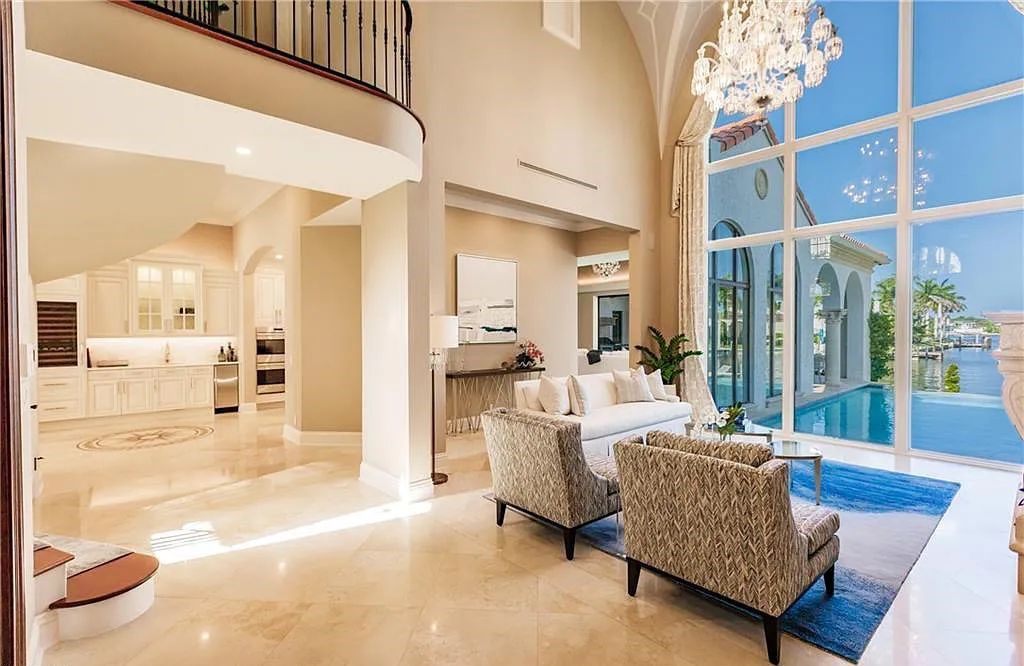 Discover the ultimate Naples, Florida retreat at 2450 Tarpon Road, "The Gateway to Naples Bay." This exceptional property offers a luxurious 4+den/4.5 bath home with 4,450 square feet of living space, recently re-decorated and furnished by Clive Daniel