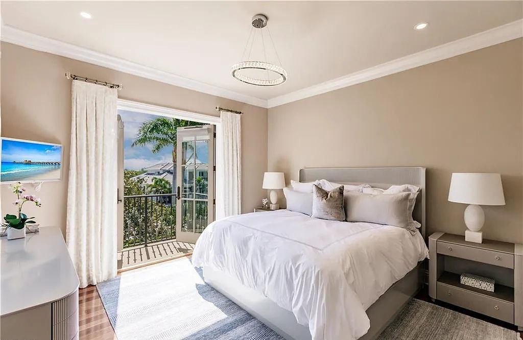 Discover the ultimate Naples, Florida retreat at 2450 Tarpon Road, "The Gateway to Naples Bay." This exceptional property offers a luxurious 4+den/4.5 bath home with 4,450 square feet of living space, recently re-decorated and furnished by Clive Daniel