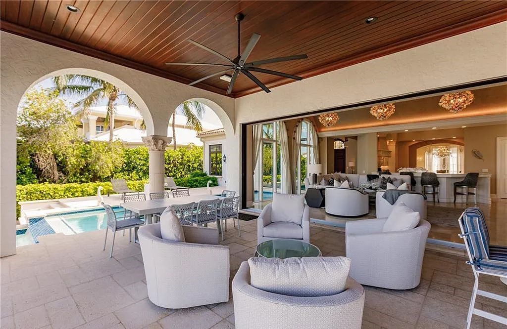 Discover the ultimate Naples, Florida retreat at 2450 Tarpon Road, "The Gateway to Naples Bay." This exceptional property offers a luxurious 4+den/4.5 bath home with 4,450 square feet of living space, recently re-decorated and furnished by Clive Daniel