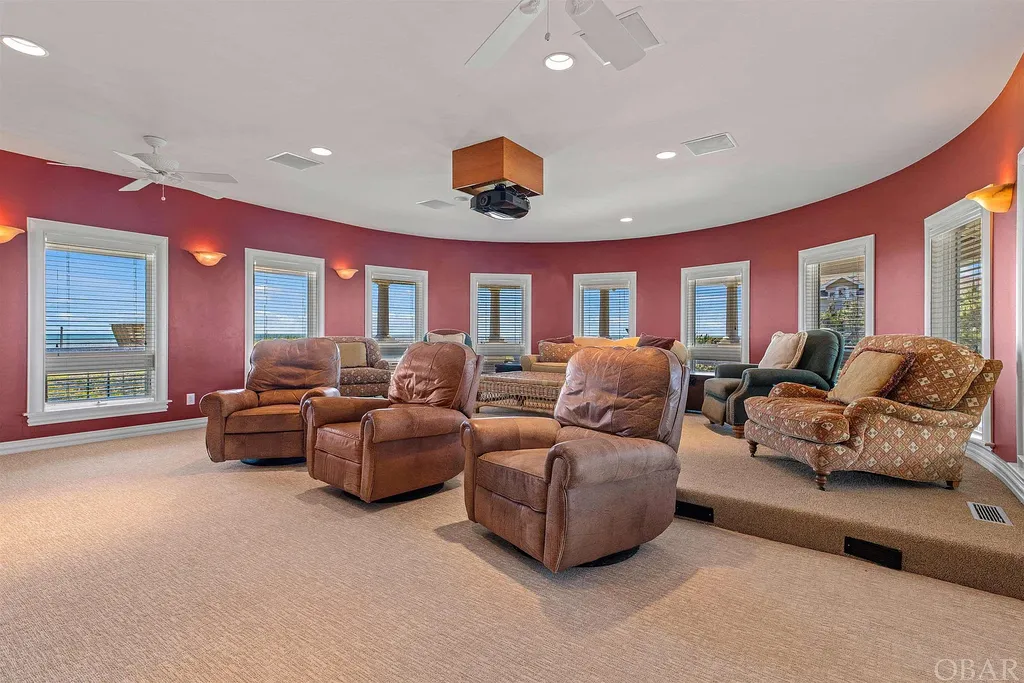 101 Station One Lane Home in Corolla, North Carolina. Discover a remarkable beachfront home with panoramic water views in the prestigious community of Pine Island, Corolla. This stunning coastal retreat offers nine bedrooms with en-suite bathrooms, generous indoor and outdoor amenities, and direct access to 250 feet of secluded beach. 