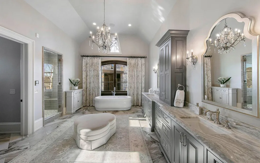 10416 Leonidas Meadow Way Home in Knoxville, Tennessee. Experience the epitome of lakeside luxury in the prestigious West Knoxville enclave of Arcadia. Nestled within this exclusive community, this opulent estate stretches across more than 2.5 acres of prime lakefront property, offering an astonishing 13,000 square feet of meticulously crafted living space. With custom millwork and intricate stonework adorning every corner, this slate and stone residence was artfully constructed with lavishness in mind.