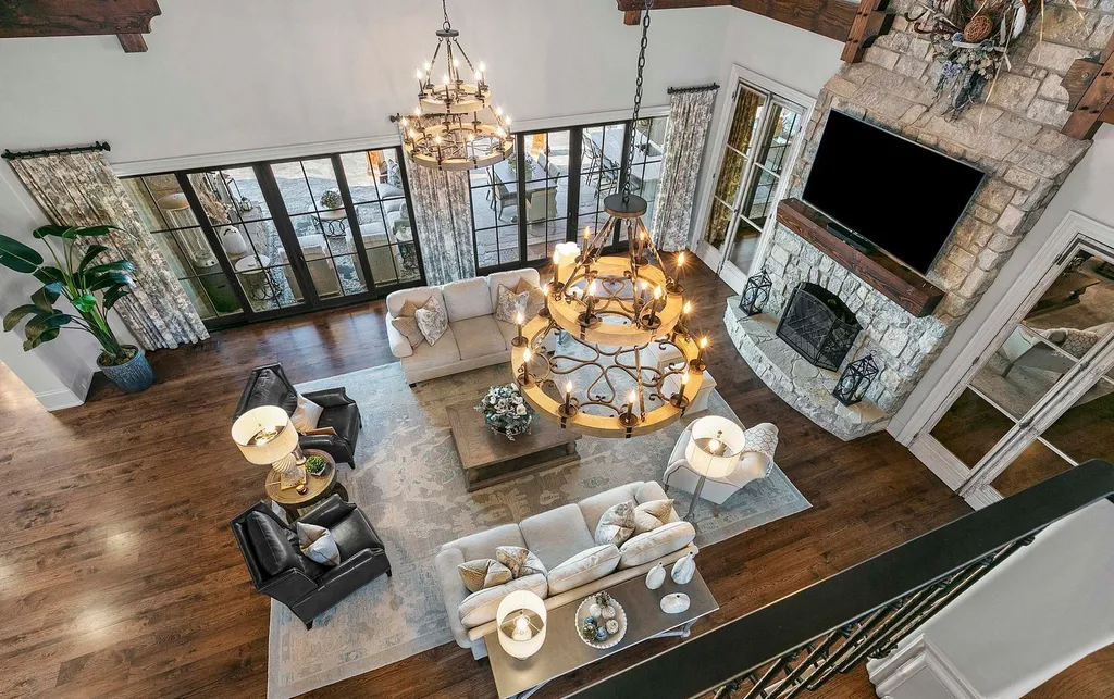 10416 Leonidas Meadow Way Home in Knoxville, Tennessee. Experience the epitome of lakeside luxury in the prestigious West Knoxville enclave of Arcadia. Nestled within this exclusive community, this opulent estate stretches across more than 2.5 acres of prime lakefront property, offering an astonishing 13,000 square feet of meticulously crafted living space. With custom millwork and intricate stonework adorning every corner, this slate and stone residence was artfully constructed with lavishness in mind.