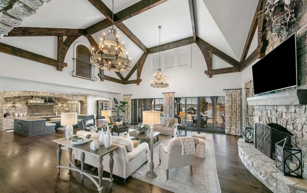 10416 Leonidas Meadow Way Home in Knoxville, Tennessee. Experience the epitome of lakeside luxury in the prestigious West Knoxville enclave of Arcadia. Nestled within this exclusive community, this opulent estate stretches across more than 2.5 acres of prime lakefront property, offering an astonishing 13,000 square feet of meticulously crafted living space. With custom millwork and intricate stonework adorning every corner, this slate and stone residence was artfully constructed with lavishness in mind.