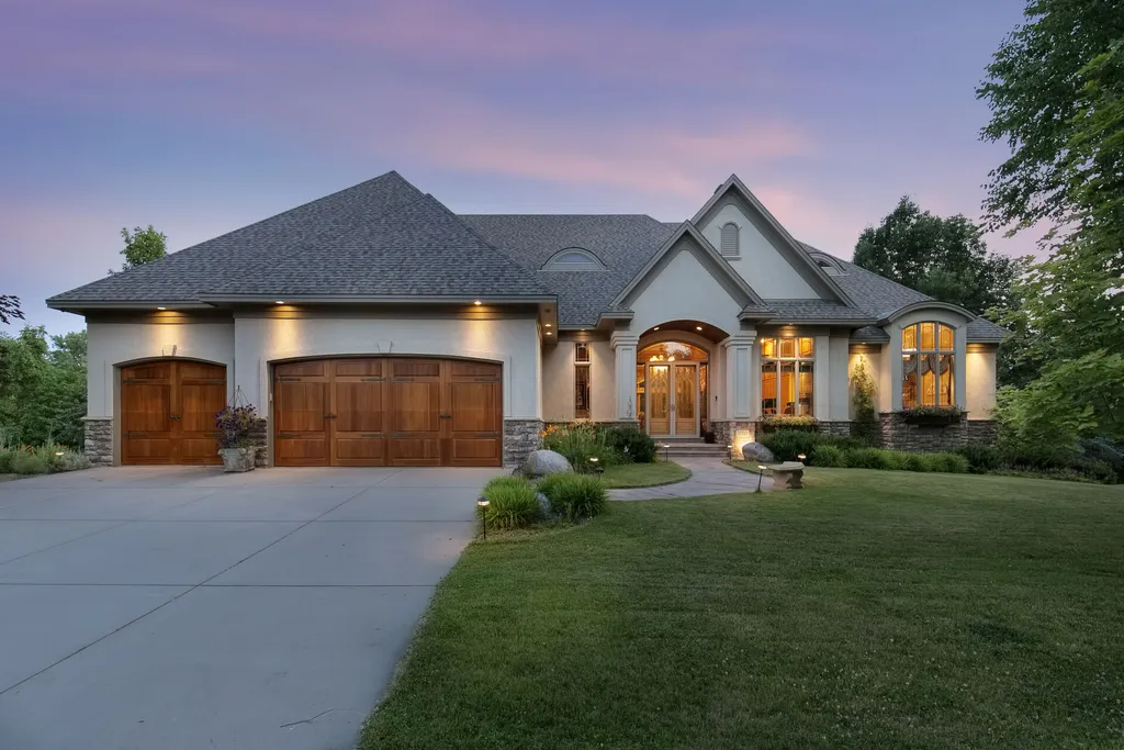 11343 Entrevaux Drive Home in Eden Prairie, Minnesota. Discover the epitome of luxury living in this custom-built Wooddale home, nestled on a serene lot with an extraordinary backyard oasis. The resort-style concrete pool, hot tub, waterfalls, expansive deck, and pergola with a fireplace create an entertainer's dream.