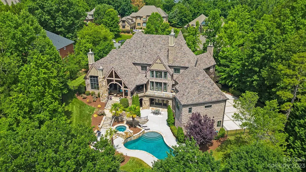 12144 James Jack Lane Home in Charlotte, North Carolina. Discover the epitome of luxury living in this stunning estate nestled on a private cul-de-sac lot with breathtaking views of the 12th and 13th holes of Ballantyne Country Club's finest golf course. 