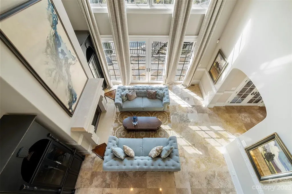12144 James Jack Lane Home in Charlotte, North Carolina. Discover the epitome of luxury living in this stunning estate nestled on a private cul-de-sac lot with breathtaking views of the 12th and 13th holes of Ballantyne Country Club's finest golf course. 