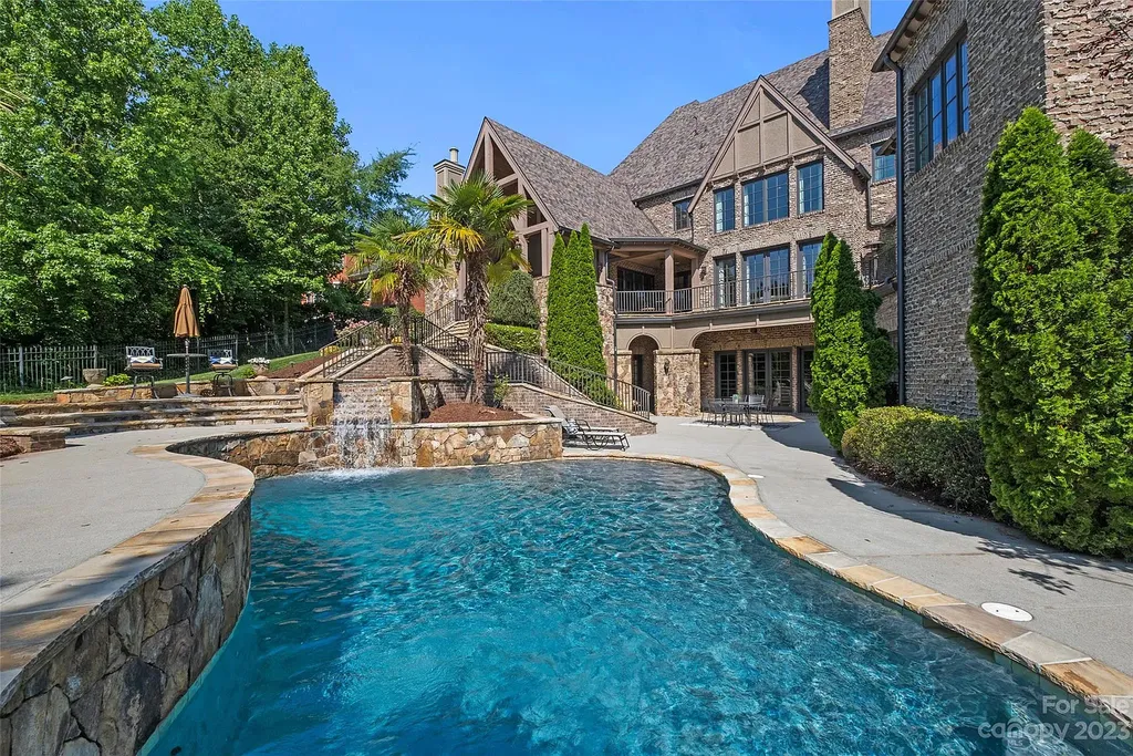 12144 James Jack Lane Home in Charlotte, North Carolina. Discover the epitome of luxury living in this stunning estate nestled on a private cul-de-sac lot with breathtaking views of the 12th and 13th holes of Ballantyne Country Club's finest golf course. 