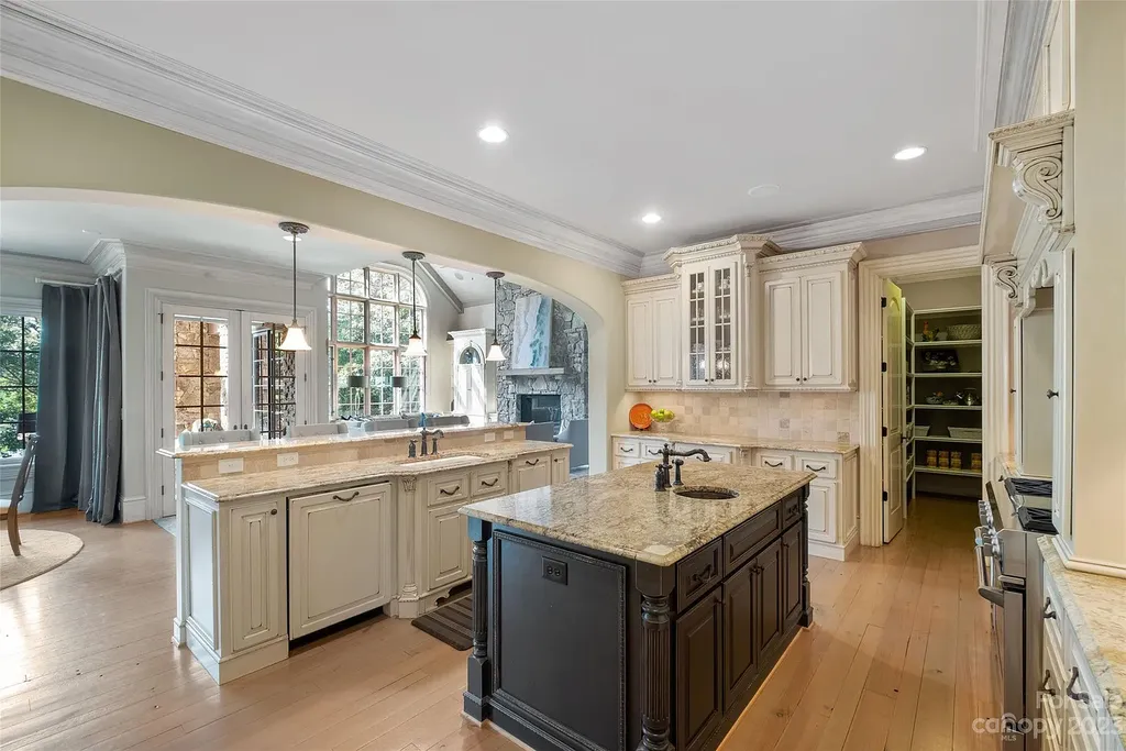 12144 James Jack Lane Home in Charlotte, North Carolina. Discover the epitome of luxury living in this stunning estate nestled on a private cul-de-sac lot with breathtaking views of the 12th and 13th holes of Ballantyne Country Club's finest golf course. 