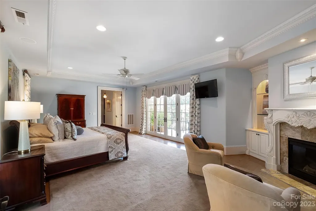 12144 James Jack Lane Home in Charlotte, North Carolina. Discover the epitome of luxury living in this stunning estate nestled on a private cul-de-sac lot with breathtaking views of the 12th and 13th holes of Ballantyne Country Club's finest golf course. 