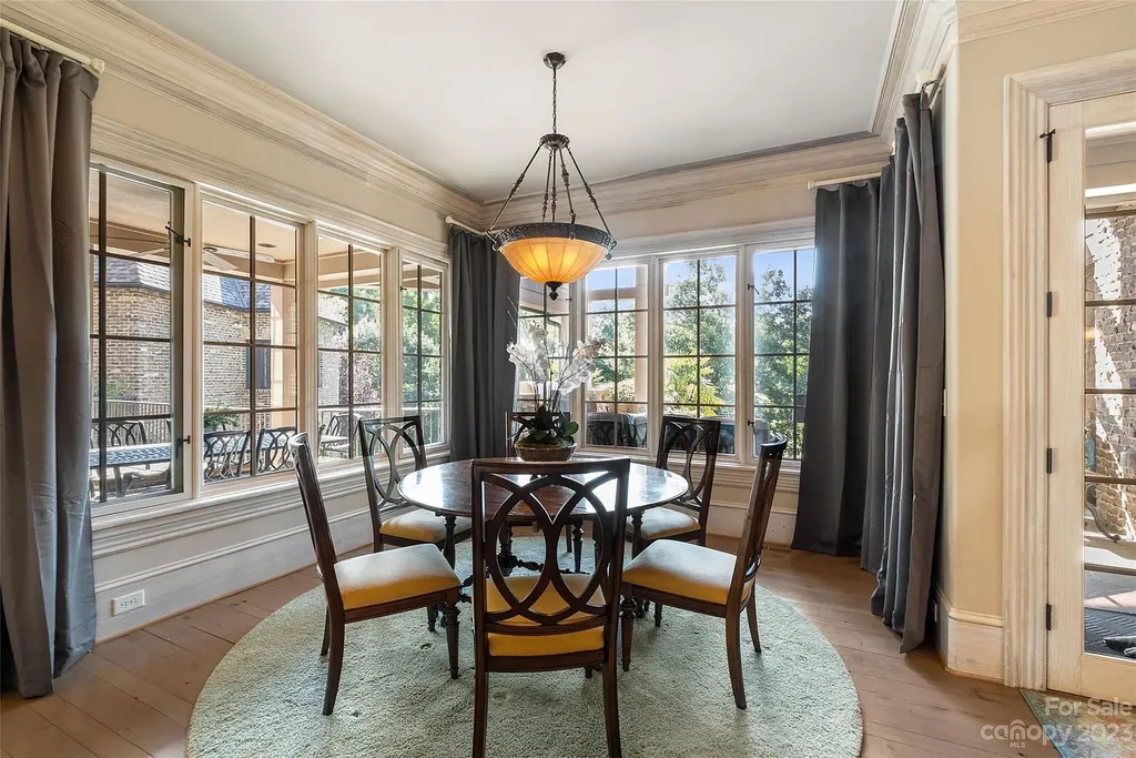 12144 James Jack Lane Home in Charlotte, North Carolina. Discover the epitome of luxury living in this stunning estate nestled on a private cul-de-sac lot with breathtaking views of the 12th and 13th holes of Ballantyne Country Club's finest golf course. 