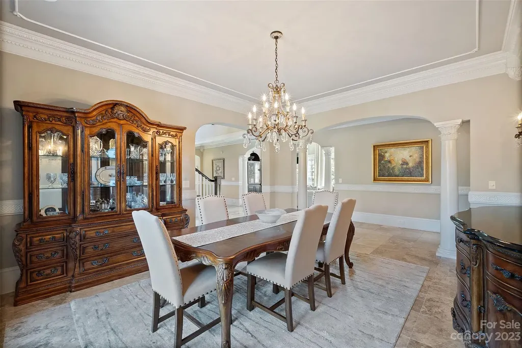 12144 James Jack Lane Home in Charlotte, North Carolina. Discover the epitome of luxury living in this stunning estate nestled on a private cul-de-sac lot with breathtaking views of the 12th and 13th holes of Ballantyne Country Club's finest golf course. 