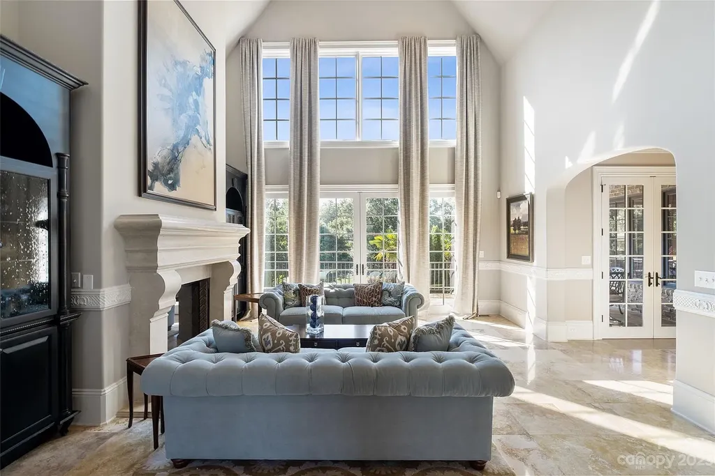 12144 James Jack Lane Home in Charlotte, North Carolina. Discover the epitome of luxury living in this stunning estate nestled on a private cul-de-sac lot with breathtaking views of the 12th and 13th holes of Ballantyne Country Club's finest golf course. 