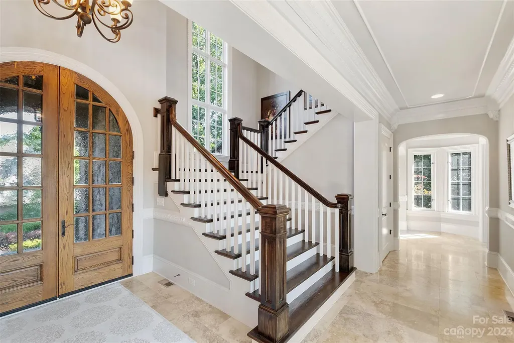 12144 James Jack Lane Home in Charlotte, North Carolina. Discover the epitome of luxury living in this stunning estate nestled on a private cul-de-sac lot with breathtaking views of the 12th and 13th holes of Ballantyne Country Club's finest golf course. 