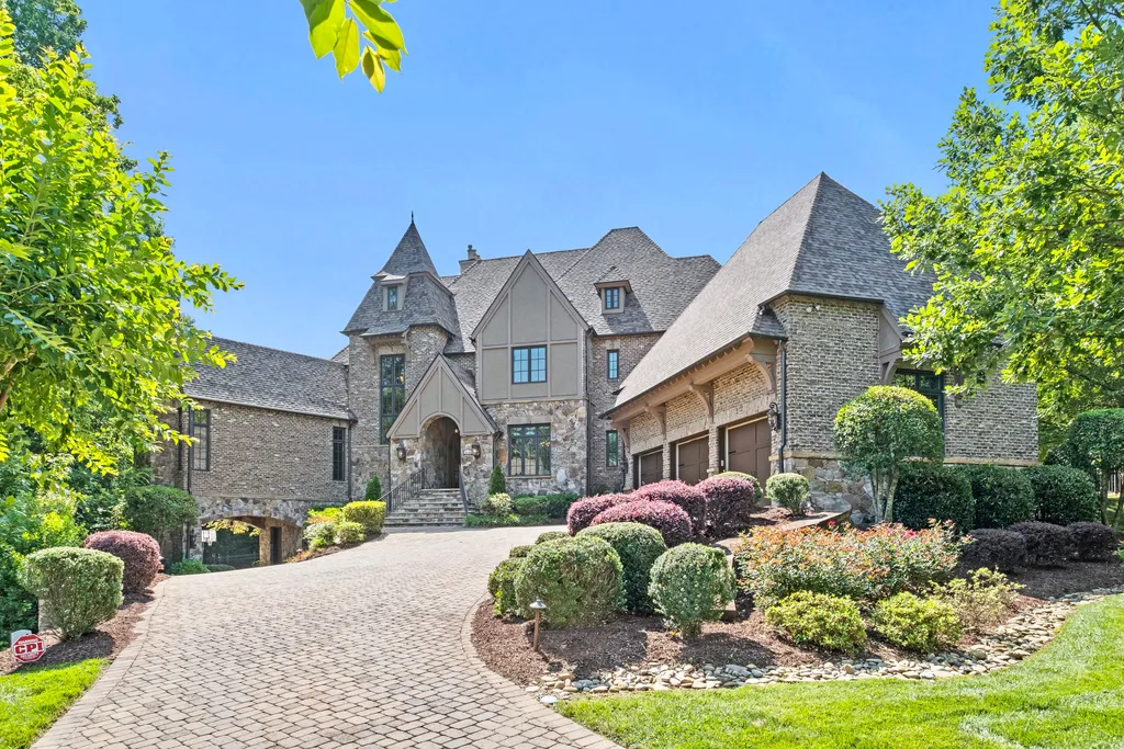 12144 James Jack Lane Home in Charlotte, North Carolina. Discover the epitome of luxury living in this stunning estate nestled on a private cul-de-sac lot with breathtaking views of the 12th and 13th holes of Ballantyne Country Club's finest golf course. 
