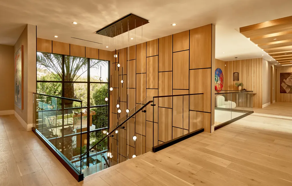 13187 Chalon Road Home in Los Angeles, California. Embrace the epitome of modern luxury living at Allure, a stunning estate designed by award-winning Developer Ramtin Ray Nosrati. Set on 1.3 acres of picturesque California landscape, this idyllic paradise offers resort-quality amenities including a pickleball court, a professional-size basketball/sports court, putting green, and more. 