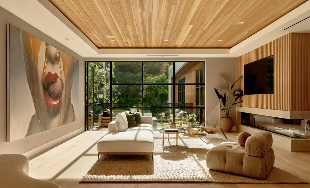 13187 Chalon Road Home in Los Angeles, California. Embrace the epitome of modern luxury living at Allure, a stunning estate designed by award-winning Developer Ramtin Ray Nosrati. Set on 1.3 acres of picturesque California landscape, this idyllic paradise offers resort-quality amenities including a pickleball court, a professional-size basketball/sports court, putting green, and more. 