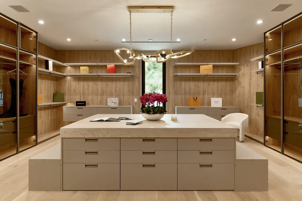13187 Chalon Road Home in Los Angeles, California. Embrace the epitome of modern luxury living at Allure, a stunning estate designed by award-winning Developer Ramtin Ray Nosrati. Set on 1.3 acres of picturesque California landscape, this idyllic paradise offers resort-quality amenities including a pickleball court, a professional-size basketball/sports court, putting green, and more. 