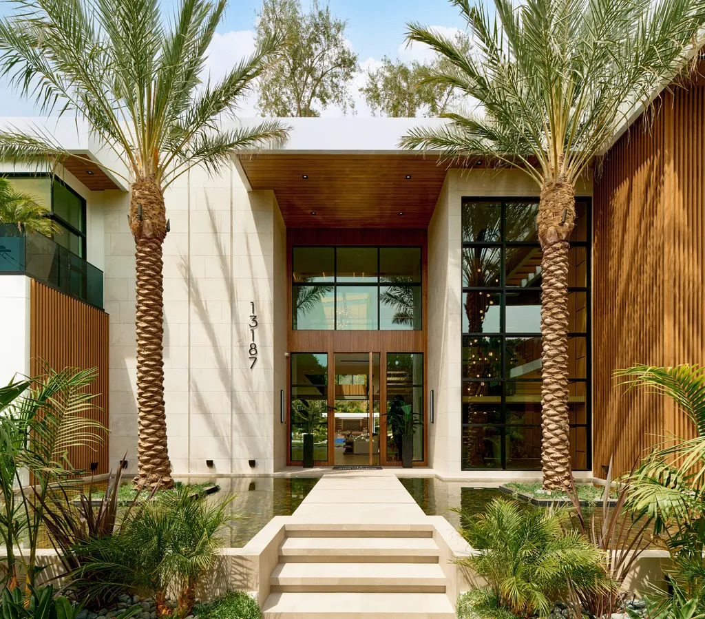 13187 Chalon Road Home in Los Angeles, California. Embrace the epitome of modern luxury living at Allure, a stunning estate designed by award-winning Developer Ramtin Ray Nosrati. Set on 1.3 acres of picturesque California landscape, this idyllic paradise offers resort-quality amenities including a pickleball court, a professional-size basketball/sports court, putting green, and more. 