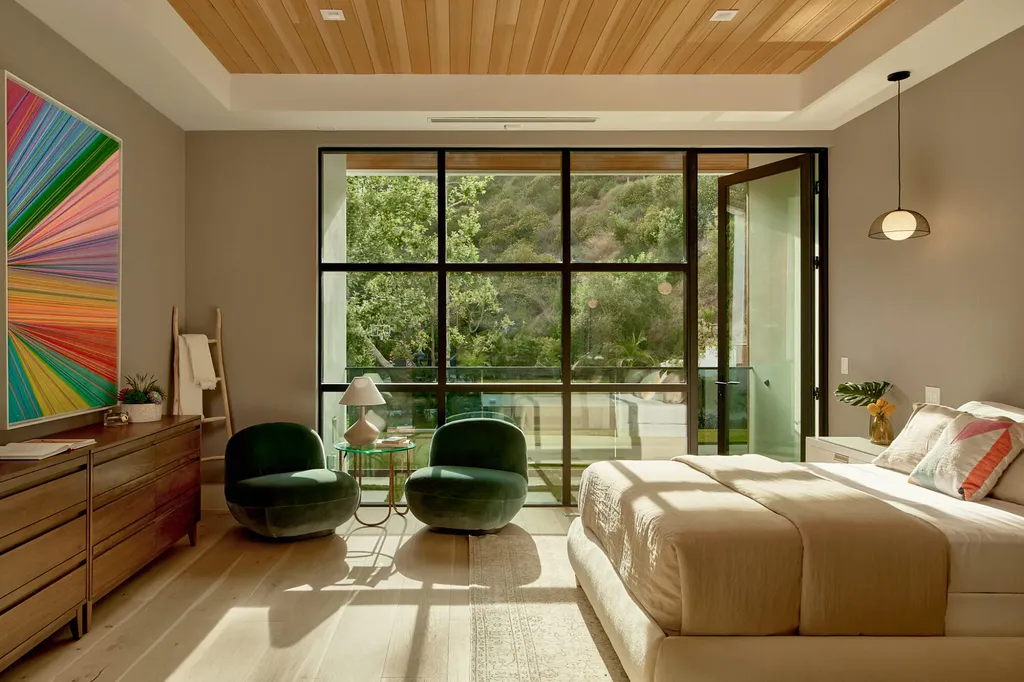 13187 Chalon Road Home in Los Angeles, California. Embrace the epitome of modern luxury living at Allure, a stunning estate designed by award-winning Developer Ramtin Ray Nosrati. Set on 1.3 acres of picturesque California landscape, this idyllic paradise offers resort-quality amenities including a pickleball court, a professional-size basketball/sports court, putting green, and more. 