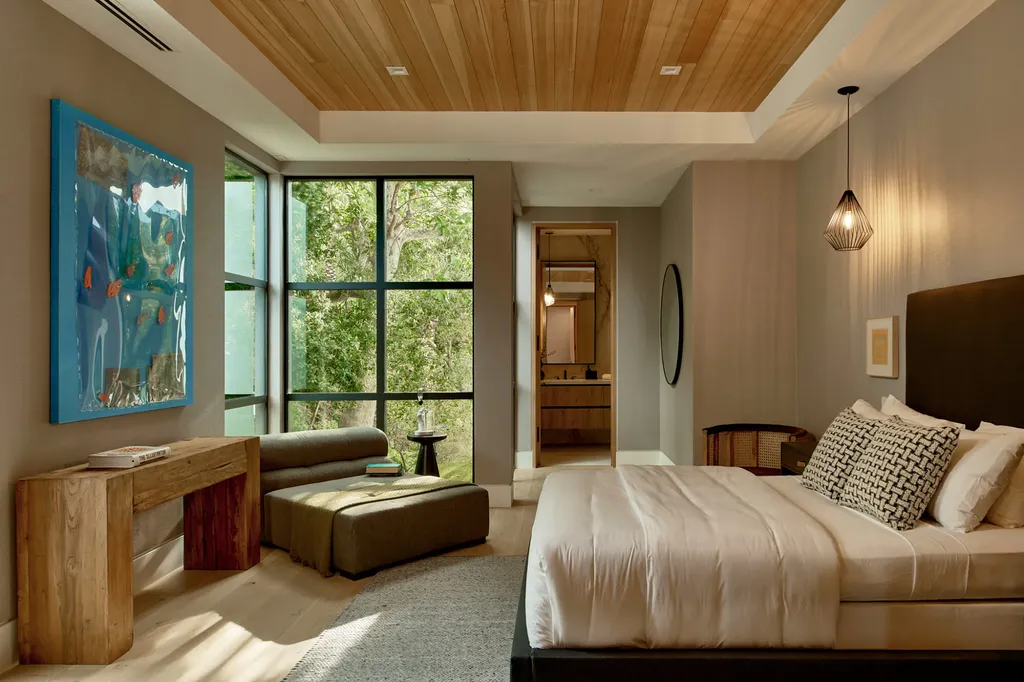 13187 Chalon Road Home in Los Angeles, California. Embrace the epitome of modern luxury living at Allure, a stunning estate designed by award-winning Developer Ramtin Ray Nosrati. Set on 1.3 acres of picturesque California landscape, this idyllic paradise offers resort-quality amenities including a pickleball court, a professional-size basketball/sports court, putting green, and more. 