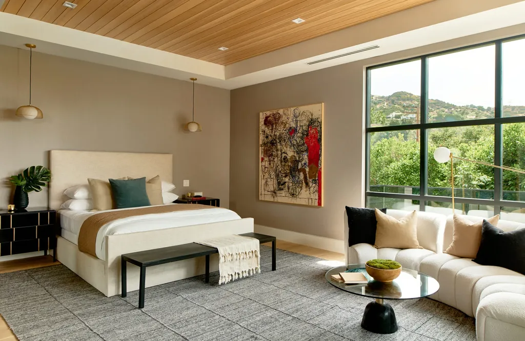 13187 Chalon Road Home in Los Angeles, California. Embrace the epitome of modern luxury living at Allure, a stunning estate designed by award-winning Developer Ramtin Ray Nosrati. Set on 1.3 acres of picturesque California landscape, this idyllic paradise offers resort-quality amenities including a pickleball court, a professional-size basketball/sports court, putting green, and more. 