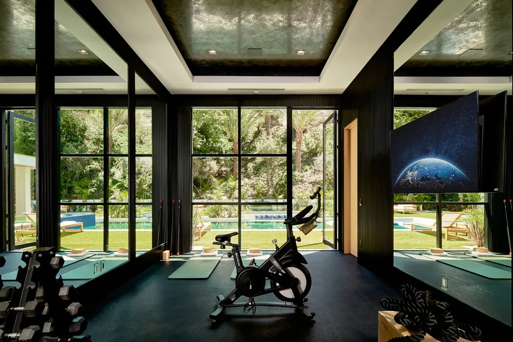 13187 Chalon Road Home in Los Angeles, California. Embrace the epitome of modern luxury living at Allure, a stunning estate designed by award-winning Developer Ramtin Ray Nosrati. Set on 1.3 acres of picturesque California landscape, this idyllic paradise offers resort-quality amenities including a pickleball court, a professional-size basketball/sports court, putting green, and more. 