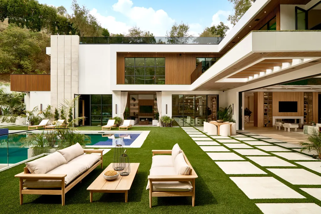 13187 Chalon Road Home in Los Angeles, California. Embrace the epitome of modern luxury living at Allure, a stunning estate designed by award-winning Developer Ramtin Ray Nosrati. Set on 1.3 acres of picturesque California landscape, this idyllic paradise offers resort-quality amenities including a pickleball court, a professional-size basketball/sports court, putting green, and more. 