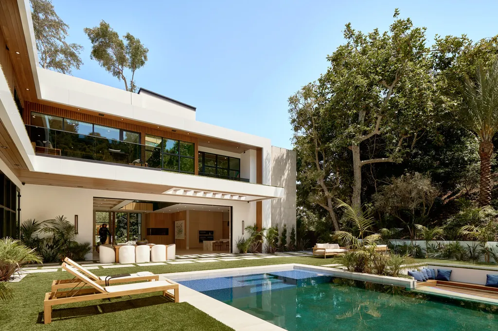 13187 Chalon Road Home in Los Angeles, California. Embrace the epitome of modern luxury living at Allure, a stunning estate designed by award-winning Developer Ramtin Ray Nosrati. Set on 1.3 acres of picturesque California landscape, this idyllic paradise offers resort-quality amenities including a pickleball court, a professional-size basketball/sports court, putting green, and more. 
