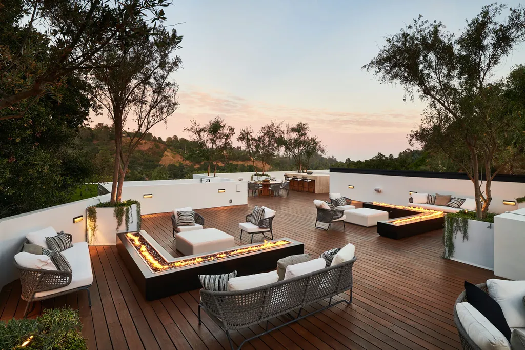13187 Chalon Road Home in Los Angeles, California. Embrace the epitome of modern luxury living at Allure, a stunning estate designed by award-winning Developer Ramtin Ray Nosrati. Set on 1.3 acres of picturesque California landscape, this idyllic paradise offers resort-quality amenities including a pickleball court, a professional-size basketball/sports court, putting green, and more. 