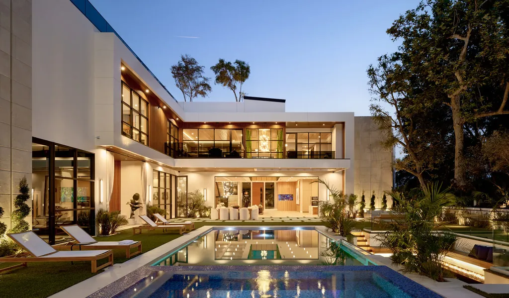13187 Chalon Road Home in Los Angeles, California. Embrace the epitome of modern luxury living at Allure, a stunning estate designed by award-winning Developer Ramtin Ray Nosrati. Set on 1.3 acres of picturesque California landscape, this idyllic paradise offers resort-quality amenities including a pickleball court, a professional-size basketball/sports court, putting green, and more. 