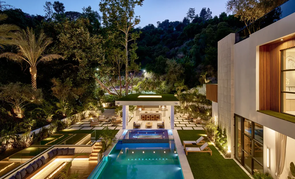 13187 Chalon Road Home in Los Angeles, California. Embrace the epitome of modern luxury living at Allure, a stunning estate designed by award-winning Developer Ramtin Ray Nosrati. Set on 1.3 acres of picturesque California landscape, this idyllic paradise offers resort-quality amenities including a pickleball court, a professional-size basketball/sports court, putting green, and more. 