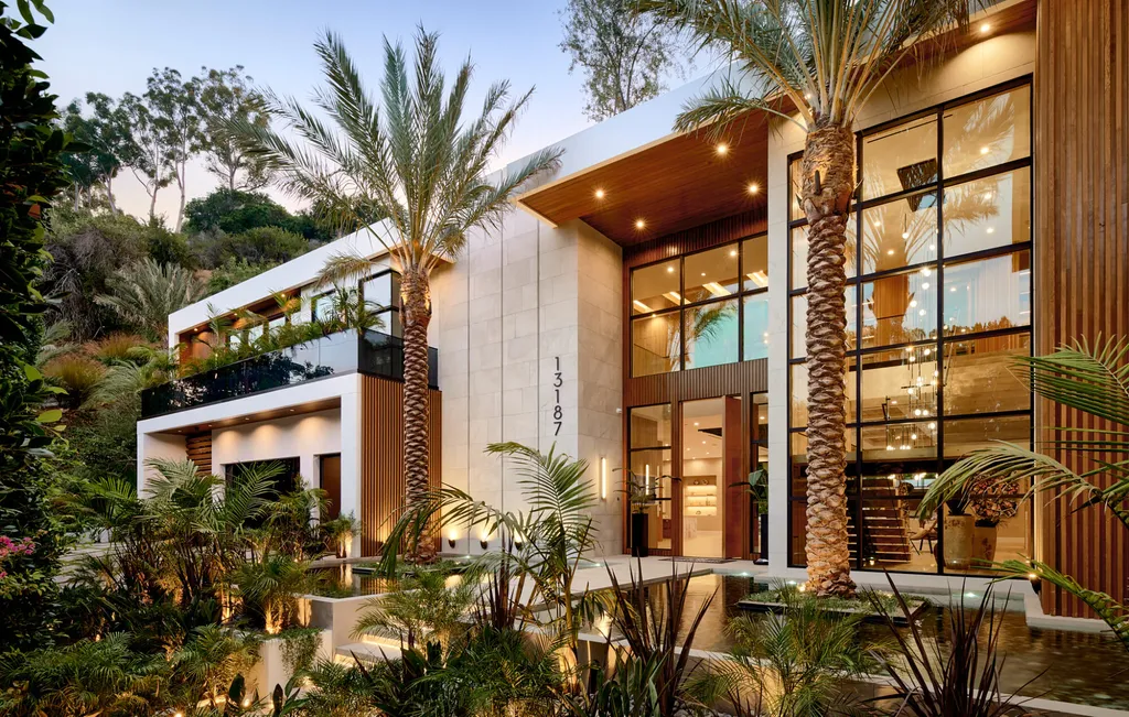 13187 Chalon Road Home in Los Angeles, California. Embrace the epitome of modern luxury living at Allure, a stunning estate designed by award-winning Developer Ramtin Ray Nosrati. Set on 1.3 acres of picturesque California landscape, this idyllic paradise offers resort-quality amenities including a pickleball court, a professional-size basketball/sports court, putting green, and more. 