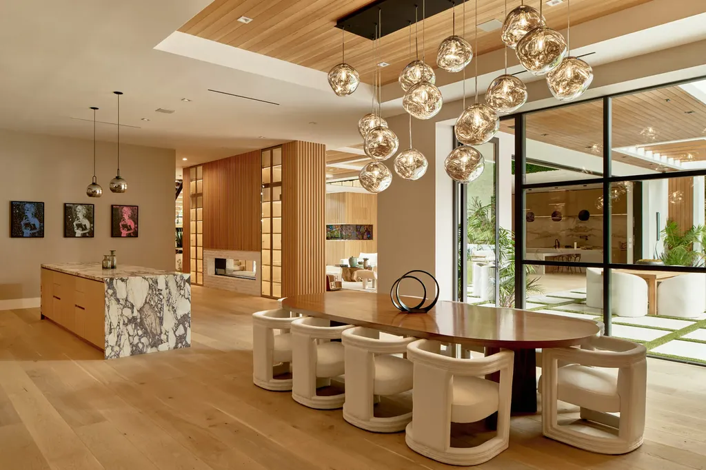 13187 Chalon Road Home in Los Angeles, California. Embrace the epitome of modern luxury living at Allure, a stunning estate designed by award-winning Developer Ramtin Ray Nosrati. Set on 1.3 acres of picturesque California landscape, this idyllic paradise offers resort-quality amenities including a pickleball court, a professional-size basketball/sports court, putting green, and more. 
