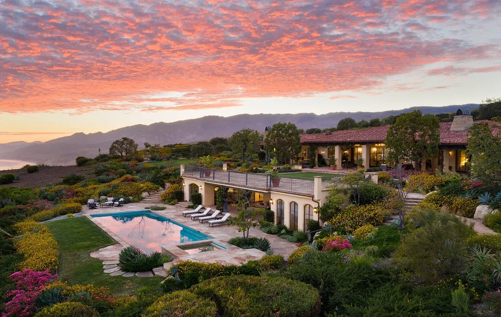 13600 Calle Real Home in Goleta, California. Escape to the enchanting Villa Del Mare, a blend of Old California charm and modern luxury on 287 acres near Refugio State Beach. With panoramic views of the coastline and foothills, this one-level estate offers 5 en suite bedrooms, spacious entertainment areas, a private helipad, and sustainable features like solar power and private water sources.