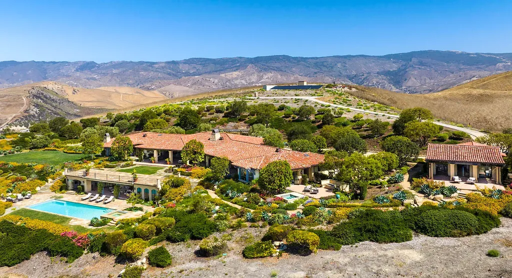 13600 Calle Real Home in Goleta, California. Escape to the enchanting Villa Del Mare, a blend of Old California charm and modern luxury on 287 acres near Refugio State Beach. With panoramic views of the coastline and foothills, this one-level estate offers 5 en suite bedrooms, spacious entertainment areas, a private helipad, and sustainable features like solar power and private water sources.