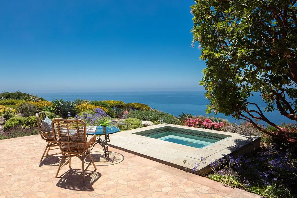 13600 Calle Real Home in Goleta, California. Escape to the enchanting Villa Del Mare, a blend of Old California charm and modern luxury on 287 acres near Refugio State Beach. With panoramic views of the coastline and foothills, this one-level estate offers 5 en suite bedrooms, spacious entertainment areas, a private helipad, and sustainable features like solar power and private water sources.