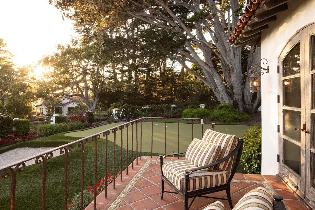 1463 Oleada Road Home in Pebble Beach, California. Explore the timeless elegance of Bella Vista, an original Pebble Beach estate nestled atop Strawberry Hill. This gated 2.6-acre haven offers panoramic views, lush gardens, and modern amenities. With a renovated 8,500+ sq ft main house, a guest house, and a studio carriage house, this Spanish-style compound showcases extraordinary entertaining spaces, outdoor fireplaces, a sport court, and more. Indulge in gourmet living with a chef's kitchen, wine cellar, and billiards room. 