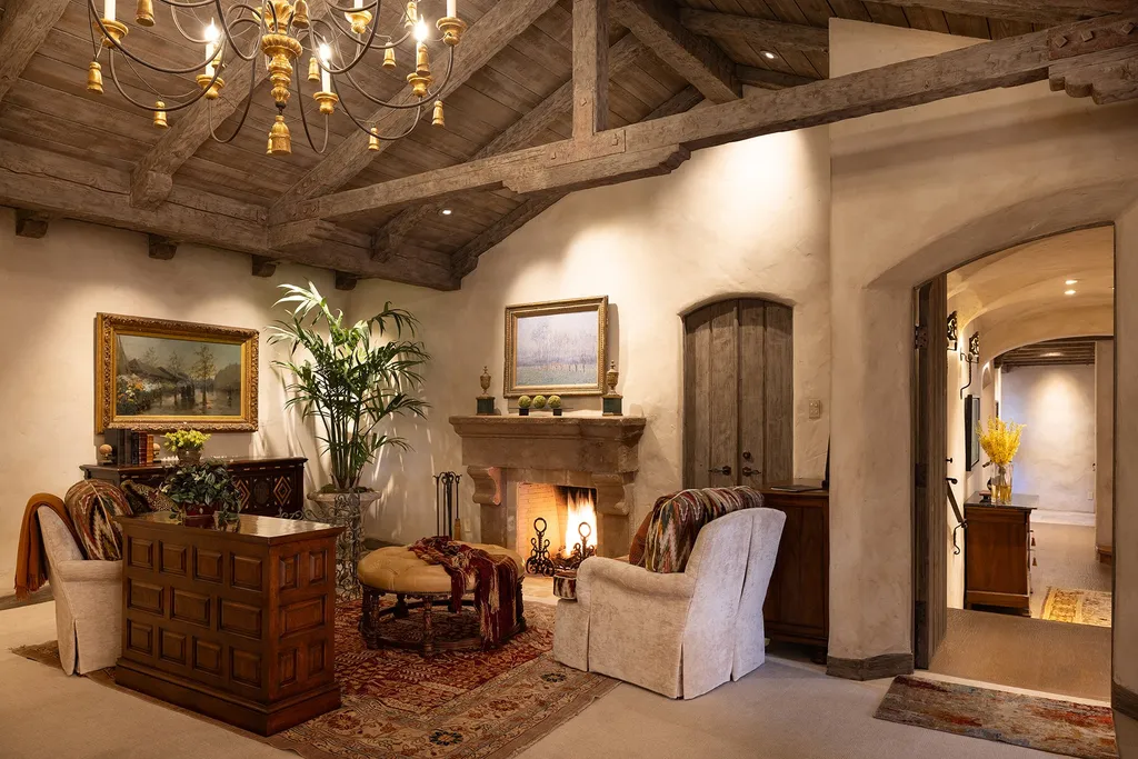 1463 Oleada Road Home in Pebble Beach, California. Explore the timeless elegance of Bella Vista, an original Pebble Beach estate nestled atop Strawberry Hill. This gated 2.6-acre haven offers panoramic views, lush gardens, and modern amenities. With a renovated 8,500+ sq ft main house, a guest house, and a studio carriage house, this Spanish-style compound showcases extraordinary entertaining spaces, outdoor fireplaces, a sport court, and more. Indulge in gourmet living with a chef's kitchen, wine cellar, and billiards room. 