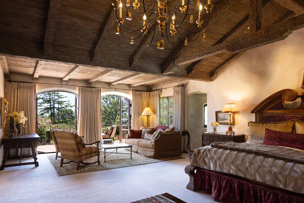 1463 Oleada Road Home in Pebble Beach, California. Explore the timeless elegance of Bella Vista, an original Pebble Beach estate nestled atop Strawberry Hill. This gated 2.6-acre haven offers panoramic views, lush gardens, and modern amenities. With a renovated 8,500+ sq ft main house, a guest house, and a studio carriage house, this Spanish-style compound showcases extraordinary entertaining spaces, outdoor fireplaces, a sport court, and more. Indulge in gourmet living with a chef's kitchen, wine cellar, and billiards room. 