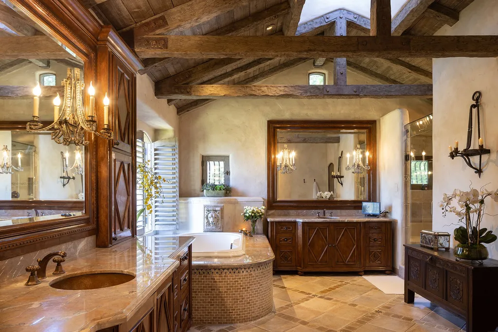 1463 Oleada Road Home in Pebble Beach, California. Explore the timeless elegance of Bella Vista, an original Pebble Beach estate nestled atop Strawberry Hill. This gated 2.6-acre haven offers panoramic views, lush gardens, and modern amenities. With a renovated 8,500+ sq ft main house, a guest house, and a studio carriage house, this Spanish-style compound showcases extraordinary entertaining spaces, outdoor fireplaces, a sport court, and more. Indulge in gourmet living with a chef's kitchen, wine cellar, and billiards room. 