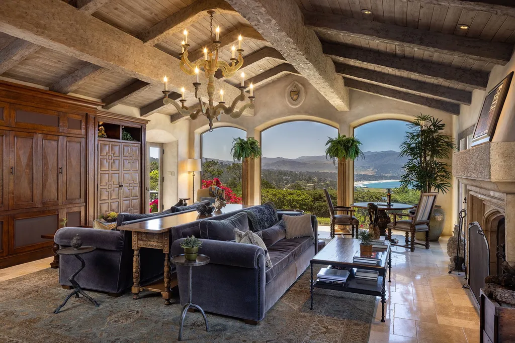 1463 Oleada Road Home in Pebble Beach, California. Explore the timeless elegance of Bella Vista, an original Pebble Beach estate nestled atop Strawberry Hill. This gated 2.6-acre haven offers panoramic views, lush gardens, and modern amenities. With a renovated 8,500+ sq ft main house, a guest house, and a studio carriage house, this Spanish-style compound showcases extraordinary entertaining spaces, outdoor fireplaces, a sport court, and more. Indulge in gourmet living with a chef's kitchen, wine cellar, and billiards room. 