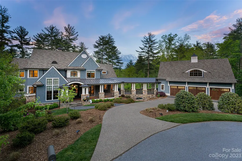 15 Presque Isle Way Home in Asheville, North Carolina. Discover the epitome of sophistication and elegance in this custom home situated on a quiet cul-de-sac. With high-quality finishes throughout, the open floor plan seamlessly integrates indoor and outdoor living spaces, including a chef's kitchen, great room, dining area, and a main level primary suite. 
